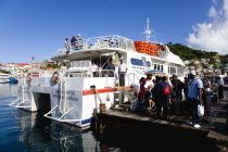 The Osprey Shuttle catamaran inter island service in the Carenage with passengers boarding in the morning for Carriacou and Petit Martinique.Caribbean Destination Destinations Grenadian Greneda West...