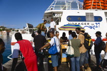 The Osprey Shuttle catamaran inter island service in the Carenage with passengers boarding in the morning for Carriacou and Petit Martinique.Caribbean Destination Destinations Grenadian Greneda West...