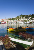 The Carenage harbour in the capital with houses lining the hillside and water taxis moored.Caribbean Destination Destinations Grenadian Greneda West Indies Grenada