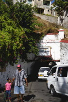The Sendall Tunnel built in 1894 with pedestrians and cars moving through it.Caribbean Destination Destinations Grenadian Greneda West Indies Grenada Automobiles Autos Ecology Entorno Environmental E...