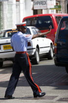 Corporal in the Royal Granada Police Force directing traffic at rush hour in the capital.Caribbean Destination Destinations Grenadian Greneda West Indies Grenada One individual Solo Lone Solitary