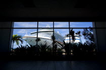 The cruise ship liners Caribbean Princess and Aida Aura docked at the Cruise Ship Terminal in the capital St Georges seen through the window of the ternminal building.Caribbean Destination Destinatio...