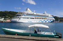 Cruise ship liner Aida Aura and local tourist boat moored on either side of the Carenage in the harbour.Caribbean Destination Destinations Grenadian Greneda West Indies Ecology Entorno Environmental...