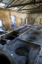 The ancient copper vats for boiling the sugarcane juice at the River Antoine rum distillery.Caribbean Destination Destinations Grenadian Greneda West Indies Grenada Farming Agraian Agricultural Growi...