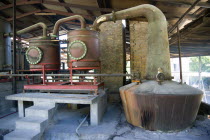 The wood fired copper stills at the River Antoine rum distillery.Caribbean Destination Destinations Grenadian Greneda West Indies Grenada