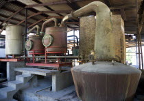 The wood fired copper stills at the River Antoine rum distillery.Caribbean Destination Destinations Grenadian Greneda West Indies Grenada