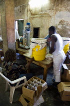 Female workers hand bottling the rum at the River Antoine distillery.Caribbean Destination Destinations Grenadian Greneda West Indies Grenada