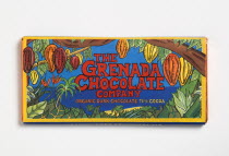 Bar of 71% percent cocoa organic dark chocolate form The Grenada Chocolate Company in colourful wrapper.Caribbean Colorful Destination Destinations Farming Agraian Agricultural Growing Husbandry  Lan...