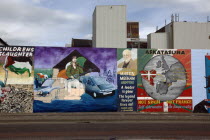 West  Falls Road  Political murals painted on walls of the Lower Falls Road area depicting MArtin meehan from Ardoyne and an unfinished mural showing the famous Black Taxi busesPoliticalNorthernBea...