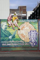 West  Falls Road. Mural depicting Liam McCarthy and some people playing HurlingHurlyHurleyPoliticalNorthernBeal FeirsteUrbanArchitectureSocial IssuesPoliticsArtGraffitiGrafittiTourTouris...