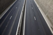 View over empty carriageways on the Westlink underpass in Belfast.TransportRoadCarsVehiclesTrafficRoadRoadsMotorwayHighwayCommunicationIrelandNorthNorthernBeal FeirsteWestLower Falls R...