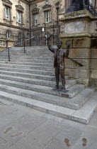 Custom House Square  Bronze statue of The Speaker on the steps. The site was originally used as a Speakers CornerPublic ArtArtUrbanBeal FeirsteArchitectureNorthernSculptureNorthern Beal Feirste...