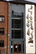 Cathedral Quarter  Cotton Court building  with mosiac patterns on the faced. A former cotton mill that hosts various art workshops including the Belfast Print Workshop.Public ArtArtUrbanBeal Feirs...