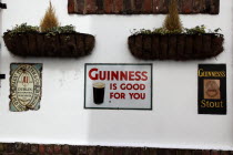 Cathedral Quarter  Commerical Court  Old metal Guinness signs decorating the exterior of the Duke of York Public House.BarCafeNorthernBeal FeirsteUrbanArchitecturePubNorthern Beal Feirste Europ...