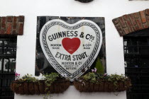 Cathedral Quarter  Commerical Court  Old metal Red Heart Belfast Bottled Guinness sign decorating the exterior of the Duke of York Public HouseBarCafeNorthernBeal FeirsteUrbanArchitecturePubNor...