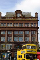 Castle Street Bank Buildings  former bank of the 4 Johns  now a retail clothing store. Yellow open top tour bus in foreground.ArchitectureUrbanBeal FeirsteNorthernTouristsToursShopsShoppingSh...