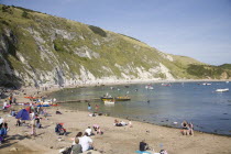 Busy beach scene with sunbathers.Blue Destination Destinations European Great Britain Holidaymakers Immature Kids Northern Europe Sand Sandy Beaches Tourism Seaside Shore Tourist Tourists Vacation Tr...