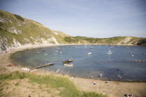 Busy beach scene with sunbathers.Blue Destination Destinations European Great Britain Holidaymakers Immature Kids Northern Europe Sand Sandy Beaches Tourism Seaside Shore Tourist Tourists Vacation Tr...