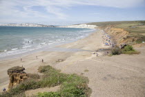 Eroded coastline and beach with road having fallen into the sea.Blue Ecology Entorno Environmental Environnement European Great Britain Green Issues Northern Europe Salt Water Waves Sand Sandy Beache...