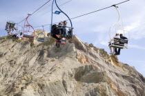 Chair Lift from the clifftop to the beach  below. Blue European Great Britain Holidaymakers Immature Northern Europe Sand Sandy Beaches Tourism Seaside Shore Tourist Tourists Vacation UK United Kingd...