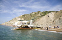 Coloured Sands  Needle Park. People waiting to get on cable chair lift from the beach to the clifftop.Blue Colored Destination Destinations European Great Britain Holidaymakers Immature Kids Northern...