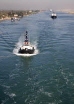Tug boat on the canal following the cruise ship from which this picture was taken.American Central America Destination Destinations Ecology Entorno Environmental Environnement Green Issues Hispanic L...