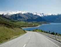 View of snow capped mountain from a lake side road.Antipodean Blue Destination Destinations Oceania Southern