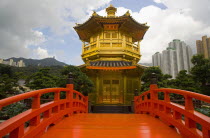 Wong Tai Sin Lian Gardens  Diamond Hill. Low angle view of a Tang Dynasty Style Chinese Golden Temple With Red Wooden Bridge Known As Pavilion Of Absolute Perfection Lotus Pond At Nan Lian Garden Diam...