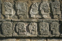Curved human skulls on stone at Chichen Itza archeological site.MayaMayanToltecHistorySunVacationHolidaysTravelArcheologyHistoricalReligionBuildingStructureArchitectureAncientExoticFo...