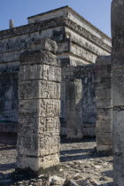 Ancient columns with curved hieroglyphics on them in front of Templo De Los Guerreros  which is situated just next to Chichen Itzas main pyramid at Chichen Itza archeological site.MayaMayanToltecH...