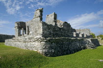 General Aspect of Tulum archeological site on a bright sunny day wirth blue sky and white clouds.MayanToltecHistorySunVacationHolidaysTravelArcheologyHistoricalReligionBuildingStructureAr...