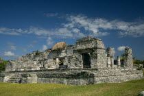 General Aspect of Tulum archeological site on a bright sunny day wirth blue sky and white clouds.MayanToltecHistorySunVacationHolidaysTravelArcheologyHistoricalReligionBuildingStructureAr...