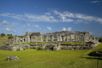 General Aspect of Tulum archeological site on a bright sunny day wirth blue sky and white clouds.MayanToltecHistorySunVacationHolidaysTravelArcheologyHistoricalReligionBuildingStructureAr...