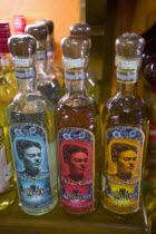 Playa del Carmen  Avenida 5. Tequila bottles with Frida Kahlo s picture on the labels.DrinkSpiritBoozeTraditionMexican ProductSouvenirCocktailSummerHolidaysVacationCultureTradeMexican Nat...