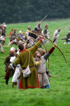 Saxon Archers at the reenactment of the 1066 Battle of Hastings.Saxon  Archers  Battle of Hastings  1066  eleventh century  11th  William the conqueror  King Harold  medieval  archer  firing  loading...