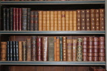 Old books on a book case inside Warwick Castle.old  books  case  bookcase  book  antique  shelves  UK  heritage  history  historic  historical  knowledge  Warwick castle  novels  leather  bound  Engl...