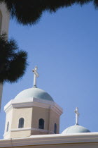 Agia Paraskevi Church.  Part view of hexagonal tower and  domed rooftop against blue sky.Greek islandsDodecaneseKosHippocratesHippocraticAegeanMediterraneanEuroholidayarchitectureCruisepor...