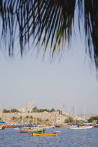 View from palm lined bay towards Bodrum castle  formerly Castle of St Peter under Knights Hospitaller of Rhodes  Ottoman since 1522. Turkish Aegean coastmediterraneanresortformerly HalicarnassusH...