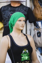 Old Town bazaar area.  Mannequin dressed in Western style vest-top with headscarf made for display by winding green T-shirt around head.Turkish Aegean coastmediterraneanresortformerly Halicarnassu...