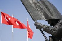 Detail of harbourside war memorial and Turkish flags. Fethiyeformerly Telmessosformerly modern Greek MakriAegeanTurkish rivieraLycianLyciastatuesculpturecommemorativecommemorate Destination...