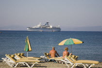 Tingaki beach Cruise ship passes offshore between kos and Turkey coast of BodrumGreek Islands Resort Summer Clear Blue Sky early season AegeanDestination Destinations Ellada European Greek Southern E...