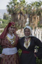 Kos Town above Roam agora. Greek women dressed for wedding.  Woman in traditional Kos dress on left  woman on the right is in traditional dress of Kalymnos  the island of sponge divers.Greek Islands...