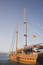 Kos Town harbour.  Day cruise boat with Turkish coast of Bodrum behind.Greek IslandsResort Summer Clear Blue Sky early season Aegean DodecaneseDestination Destinations Ellada European Greek Southern...