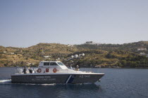 Greek Coast Guard boat cruising along the shore.Greek IslandsResort Summer Clear Blue Sky early season Aegean DodecaneseDestination Destinations Ellada European Greek Southern Europe Gray