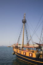 Day cruise boat in Kos Town harbour facing Turkish coast of Bodrum.Greek Islands Resort holidaySummer Clear Blue Sky early season Aegean Destination Destinations Ellada European Greek Southern E...