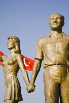 Detail of statues and the Turkish flag at the Monument of Ataturk and Youth.sculptureTurkishAegeancoastresortSummersunshineearly Summer seasonholidaydestinationdestinations ElladaEuropean...