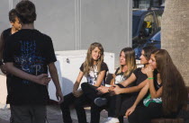 Group of young teenagers talking in the sunshine.societyconversationTurkishAegeancoastresortSummersunshineearly Summer seasonholidaydestinationdestinations ElladaEuropeanSouthern Europe...