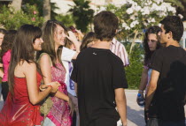 Group of teenagersconversationinteractionsocietysocietyTurkishAegeancoastresortSummersunshineearly Summer seasonholidaydestinationdestinations ElladaEuropeanSouthern Europe Cultural Cu...