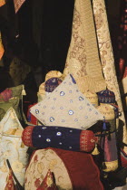 Ottoman style cushions and textiles displayed for sale to tourists in summer sun.Formerly Greek Physkos in Caria once host to AlexandeTurkish RivieracoastcoastalholidaySummerCloth Destination D...