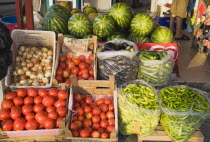 Watermelons and fresh seasonal vegetables on sale in late afternoon sun.  Typical Turkish diet of garlic  pepper  chilis  tomato   aubergine and courgetteTurkish rivieraAegeancoastcoastalOludeniz...